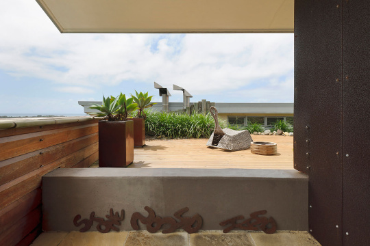 Potted plants and wicker furniture on terrace