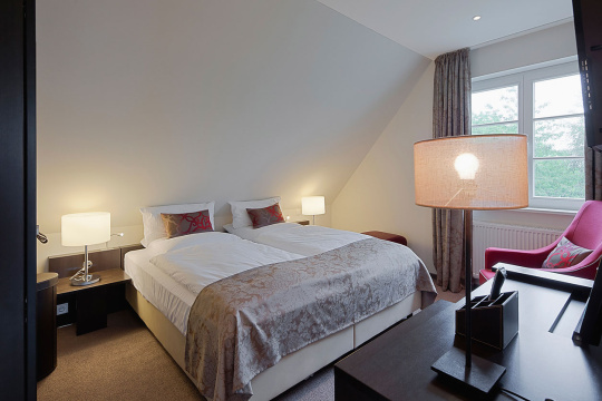 Lit lamps in contemporary bedroom