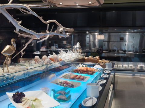 Variety of dishes on buffet counter in modern restaurant