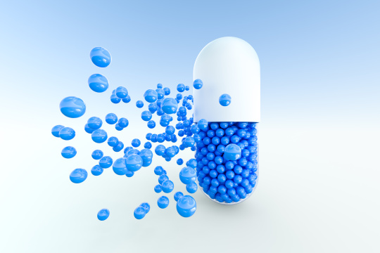 蓝色颗粒胶囊，三维渲染