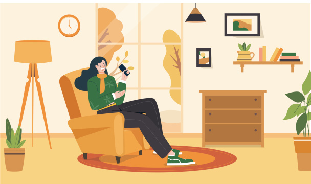 秋天女孩坐在沙发上玩手机